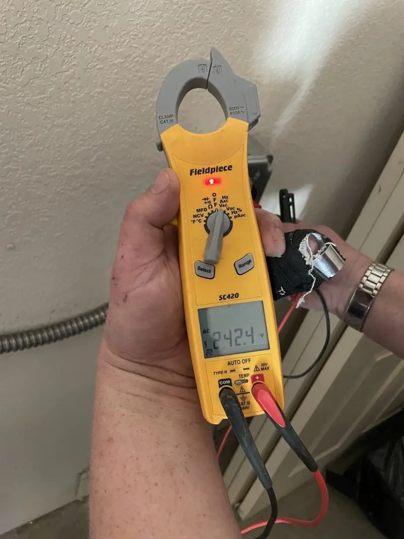 Voltage testing with clamp meter during Outlet Installation in Ogdensburg